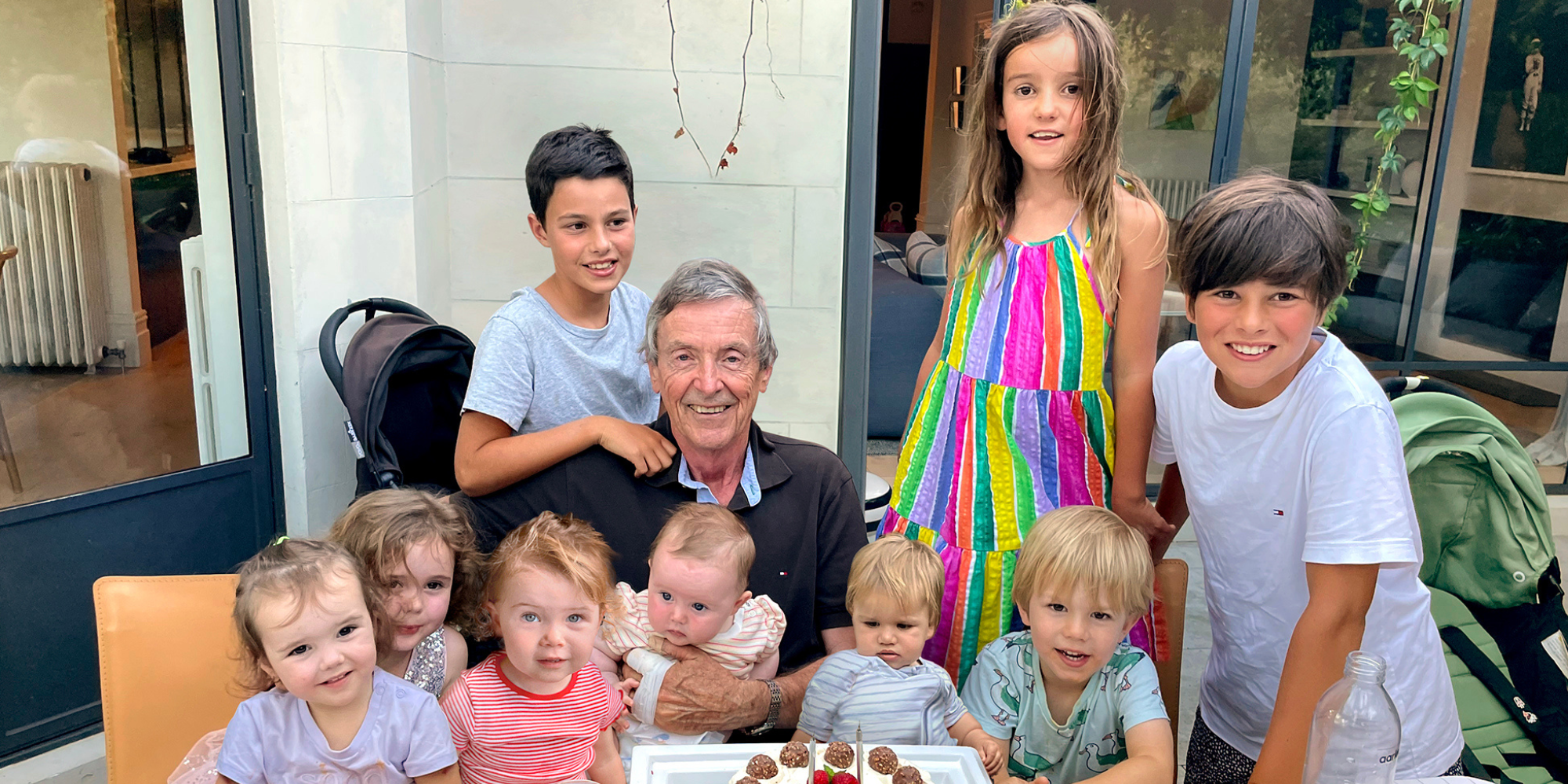Dr John Tandy with his grandchildren